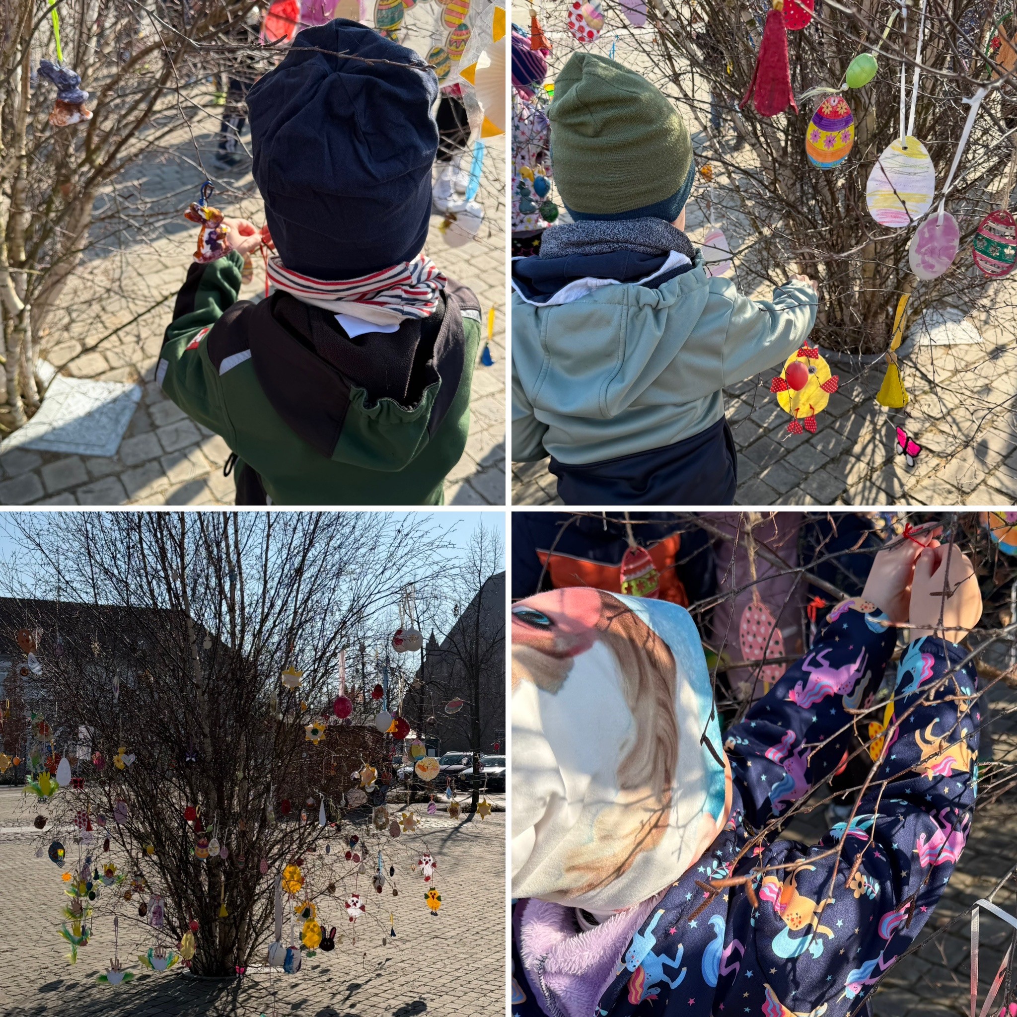 Kinder hängen Ostereier auf